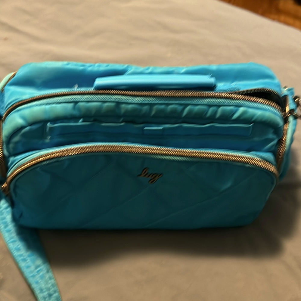 Lug Trolley CB, blue, could be shoulder or crossbody bag.